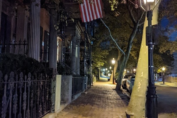 a street scene with focus on the side of a building